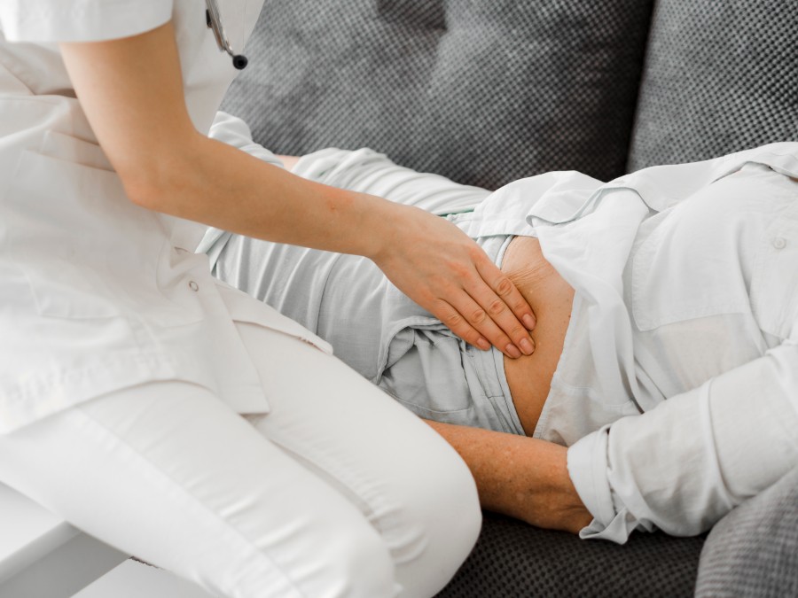 Doctor examining a patient experiencing kidney stone pain