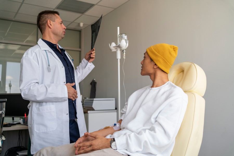 Urologist discussing kidney stone treatment with a patient during a medical consultation